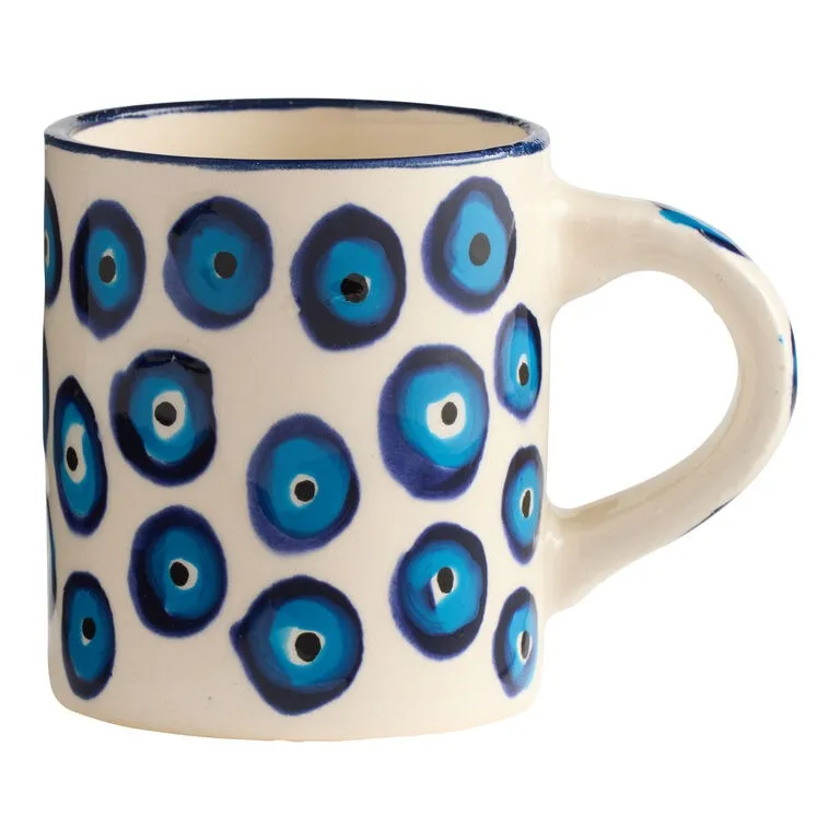 Caneca pintada à mão com círculos azuis tipo olho